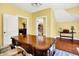 Spacious office with hardwood floors and a large decorative desk at 11557 Willow Springs Dr, Zionsville, IN 46077