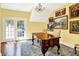 Bright office with french doors, hardwood floors, and a chandelier at 11557 Willow Springs Dr, Zionsville, IN 46077