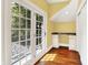 Bright office nook with double doors opening to the backyard at 11557 Willow Springs Dr, Zionsville, IN 46077