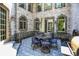 Cozy outdoor patio with decorative tile and access to main house at 11557 Willow Springs Dr, Zionsville, IN 46077