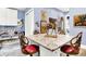 Room featuring a table with ornate chairs, a bright window, and wall art at 11557 Willow Springs Dr, Zionsville, IN 46077