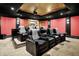 Cozy home theater featuring comfortable seating, projector screen, and elegant decor for movie enjoyment at 11557 Willow Springs Dr, Zionsville, IN 46077