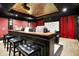 Home theater with comfortable seating, a projector, and a bar for the ultimate movie night at 11557 Willow Springs Dr, Zionsville, IN 46077