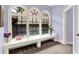 Inviting window seat beneath arched windows, complete with a carpeted floor and natural light at 11557 Willow Springs Dr, Zionsville, IN 46077