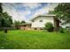 This house has a large backyard, combination brick and vinyl siding, and mature trees at 1217 S Post Rd, Indianapolis, IN 46239