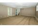 Finished basement with carpeting, access to other rooms, and neutral paint at 1217 S Post Rd, Indianapolis, IN 46239
