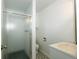 Clean bathroom with a glass shower, patterned floors, and a modern vanity at 1217 S Post Rd, Indianapolis, IN 46239