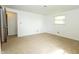 Bright bedroom features neutral carpet, white walls, and a window that lets in natural light at 1217 S Post Rd, Indianapolis, IN 46239