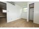 Bedroom with neutral carpeting, a closet, and bright natural light from the window at 1217 S Post Rd, Indianapolis, IN 46239