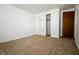 Neutral carpet and white walls make the bedroom a blank canvas at 1217 S Post Rd, Indianapolis, IN 46239