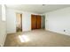 Neutral carpet and white walls create a blank canvas in this room with a bathroom and closet at 1217 S Post Rd, Indianapolis, IN 46239