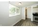 Bright eat-in kitchen with window and stainless steel oven with gray wood floors at 1217 S Post Rd, Indianapolis, IN 46239