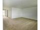 Bright, open living room with neutral carpet and fresh white walls, ready for personalization at 1217 S Post Rd, Indianapolis, IN 46239
