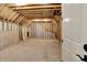 Spacious unfinished attic featuring wood framing and ample potential for customization at 12839 Bird Cage, Carmel, IN 46032
