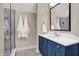 Well-lit bathroom featuring a glass-enclosed shower, neutral paint, and vanity with soft-close doors at 12839 Bird Cage, Carmel, IN 46032