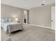 Large bedroom featuring soft carpet, neutral walls, and access to an ensuite bathroom at 12839 Bird Cage, Carmel, IN 46032