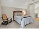 Relaxing bedroom showcasing a vaulted ceiling, soft carpet, and neutral paint at 12839 Bird Cage, Carmel, IN 46032