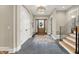Inviting foyer with hardwood floors, a decorative chandelier, and a beautiful front door at 12839 Bird Cage, Carmel, IN 46032