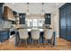 Beautiful kitchen with large island, stainless steel appliances, and modern lighting at 12839 Bird Cage, Carmel, IN 46032