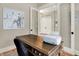 Office space with a wooden desk, white printer, and glass doors leading to the hallway at 12839 Bird Cage, Carmel, IN 46032