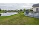 Landscaped backyard with a view of the pond, offering a tranquil setting at 12880 Oxbridge Pl, Fishers, IN 46037