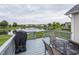 Backyard deck overlooking pond view with a fountain, providing outdoor entertainment space at 12880 Oxbridge Pl, Fishers, IN 46037