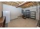Unfinished basement provides storage with an exposed ceiling, and shelving at 12880 Oxbridge Pl, Fishers, IN 46037