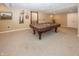 Finished basement with a pool table, natural light, and space for entertainment at 12880 Oxbridge Pl, Fishers, IN 46037