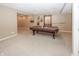 Basement area featuring a pool table and neutral carpeting provides a cozy recreational space at 12880 Oxbridge Pl, Fishers, IN 46037