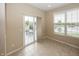 Bright dining area with sliding glass doors that lead to a deck with outdoor seating and serene pond view at 12880 Oxbridge Pl, Fishers, IN 46037