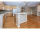 Beautiful kitchen with wooden cabinetry, stainless steel appliances, and eat-in island with barstools at 12880 Oxbridge Pl, Fishers, IN 46037