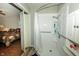 Bathroom featuring walk-in shower, grab bars, and neutral paint at 13 Fairlane Dr, Brownsburg, IN 46112
