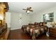 Cozy bedroom with wood flooring, ceiling fan, and natural light at 13 Fairlane Dr, Brownsburg, IN 46112