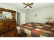Bedroom with neutral paint, wood flooring, and a ceiling fan at 13 Fairlane Dr, Brownsburg, IN 46112