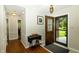 Inviting foyer with hardwood floors and decorative front door at 13 Fairlane Dr, Brownsburg, IN 46112