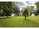 Quaint home featuring a well-kept front yard and mature trees at 13 Fairlane Dr, Brownsburg, IN 46112