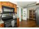 Kitchen featuring granite countertops, black appliances and pantry at 13 Fairlane Dr, Brownsburg, IN 46112