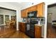 Updated kitchen with stainless steel appliances and granite countertops open to the dining room at 13 Fairlane Dr, Brownsburg, IN 46112