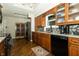 Updated kitchen with granite countertops, stainless appliances, and dark wood cabinets at 13 Fairlane Dr, Brownsburg, IN 46112