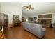 Spacious living room featuring a brick fireplace and vaulted ceiling at 13 Fairlane Dr, Brownsburg, IN 46112