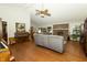 Comfortable living room with hardwood floors, fireplace, and ample seating at 13 Fairlane Dr, Brownsburg, IN 46112