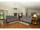 Open-concept living room with hardwood floors and comfortable seating arrangements at 13 Fairlane Dr, Brownsburg, IN 46112