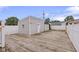 Wide open backyard featuring a wooden deck and detached garage at 1310 California St, Columbus, IN 47201