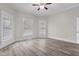 Large, naturally lit bedroom featuring modern flooring and three large windows at 1310 California St, Columbus, IN 47201