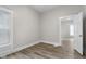 Cozy bedroom with fresh paint, modern flooring, and doorway at 1310 California St, Columbus, IN 47201