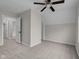 Bright bedroom featuring neutral walls, plush carpeting, and a modern ceiling fan at 1310 California St, Columbus, IN 47201