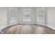 Bright bedroom featuring large windows, neutral wall color, and modern flooring at 1310 California St, Columbus, IN 47201