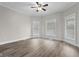 Inviting bedroom with lots of natural light, neutral paint, modern ceiling fan and flooring at 1310 California St, Columbus, IN 47201