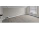 Neutral bedroom featuring carpeting, a window, and neutral colored walls at 1310 California St, Columbus, IN 47201