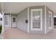 Inviting covered front porch with traditional details, offering a cozy outdoor space to relax and enjoy the neighborhood views at 1310 California St, Columbus, IN 47201